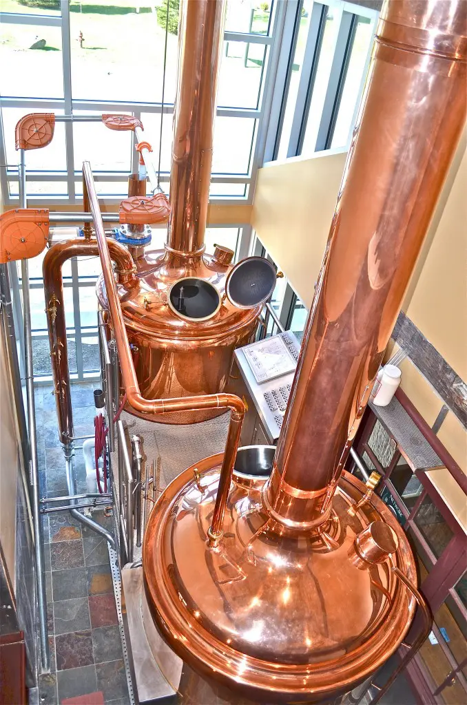 View of beer brewery interior with traditional fermenting copper vats